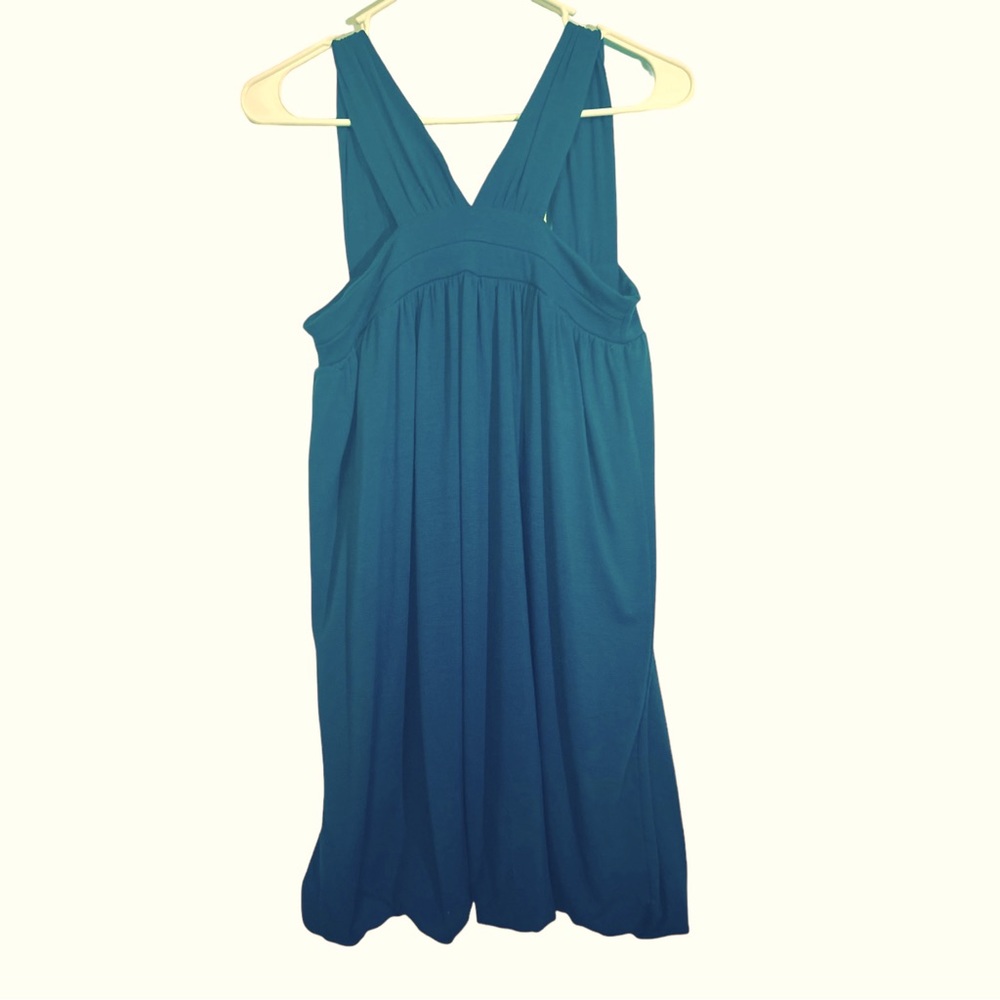Short turquoise dress NWOT No imperfections great fit. In a smoke free home